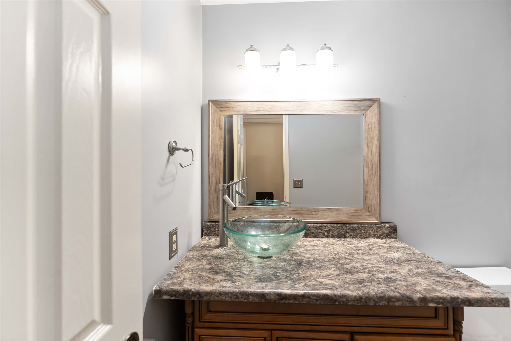 19927 Teller Boulevard Spring, TX 77388 - Photo 33 of 42 a bathroom with a granite countertop sink and a mirror