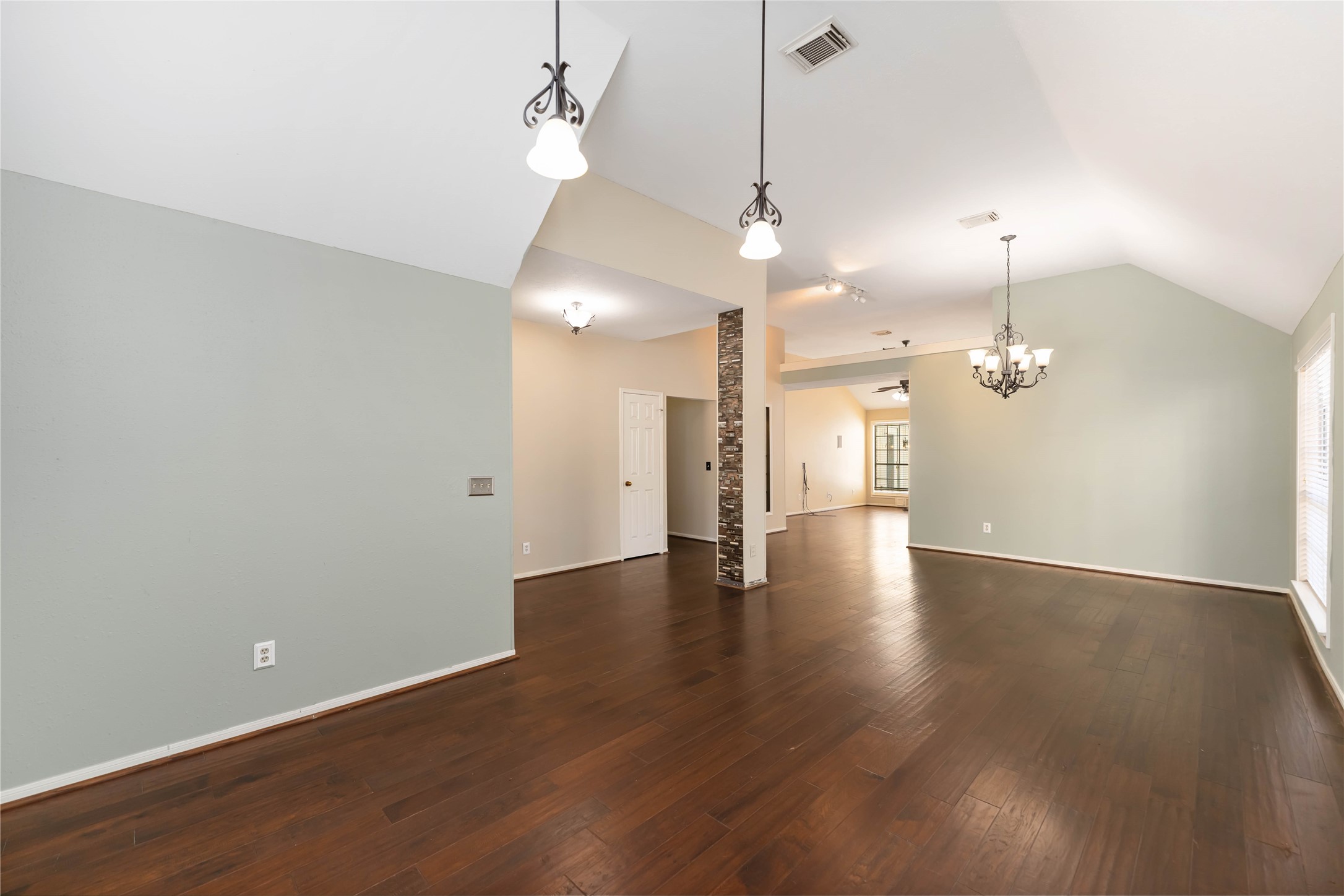 19927 Teller Boulevard Spring, TX 77388 - Photo 7 of 42 an empty room with wooden floor and windows