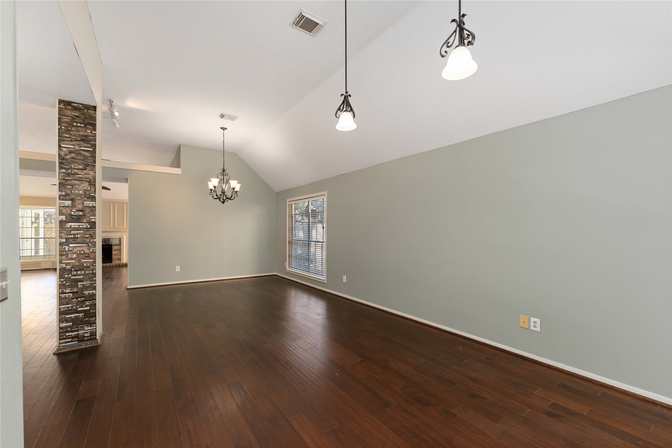 19927 Teller Boulevard Spring, TX 77388 - Photo 8 of 42 an empty room with wooden floor and windows