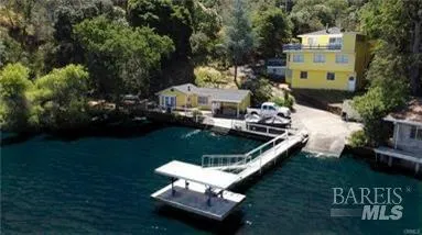 a view of a two chairs in the patio