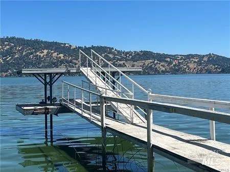 a living room with couch and wooden floor