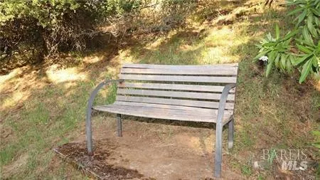 a bedroom with a bed dresser and a window