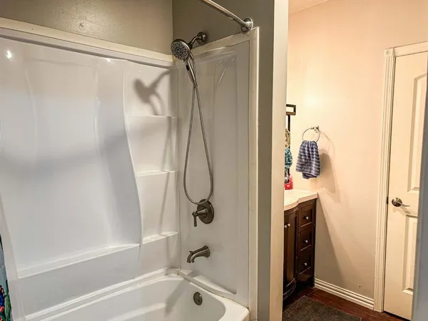 a bathroom with a sink vanity and a mirror