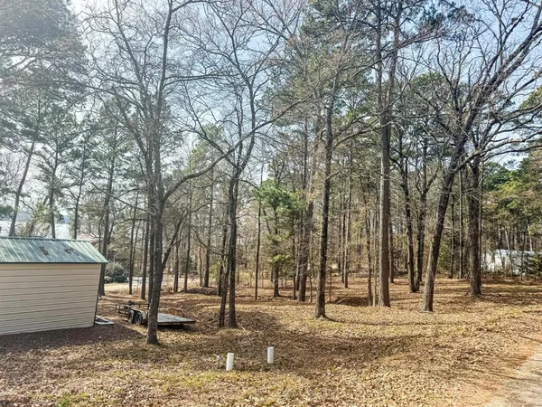 a view of a bathroom with a sink and glass door