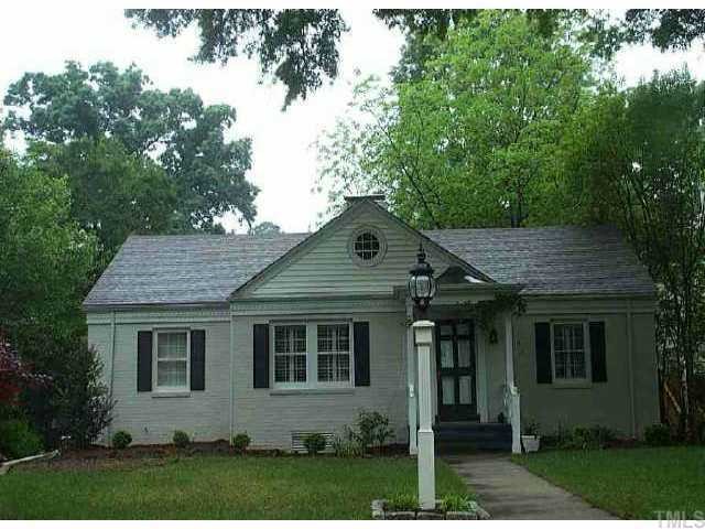 1621 Craig Street Raleigh, NC 27608 - Photo 1 of 1 a front view of a house with a yard and trees
