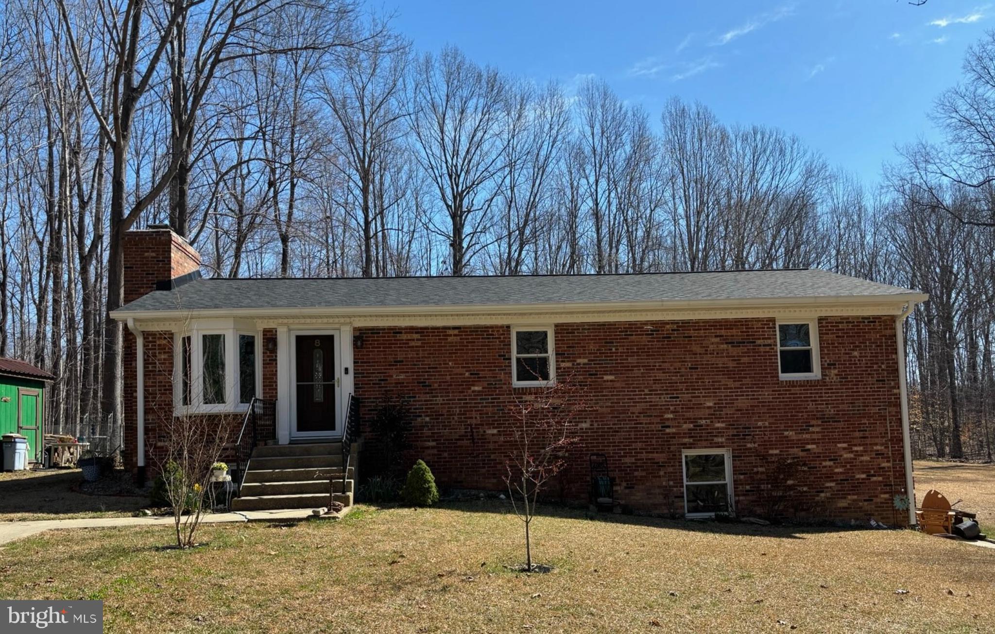 a view of house with yard