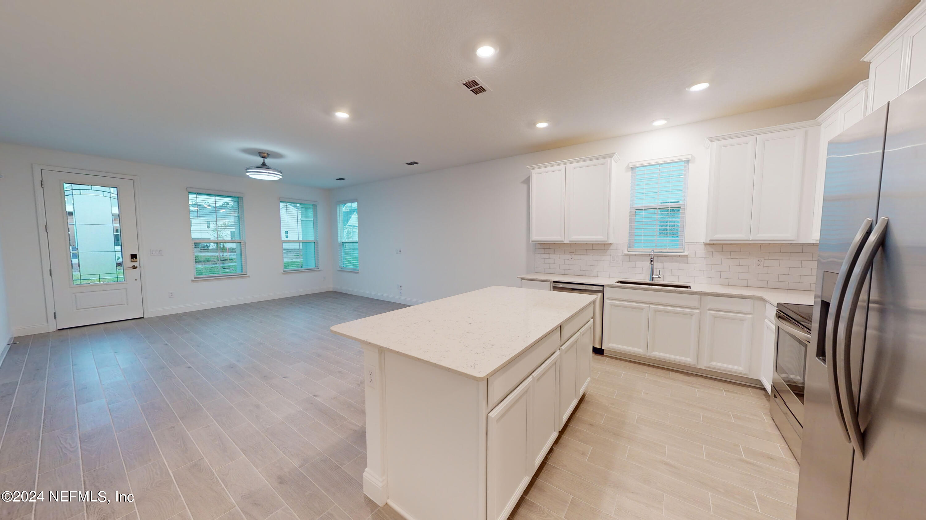 52 Tyson Ct Street St. Augustine, FL 32092 - Photo 12 of 31 a kitchen with a sink and refrigerator