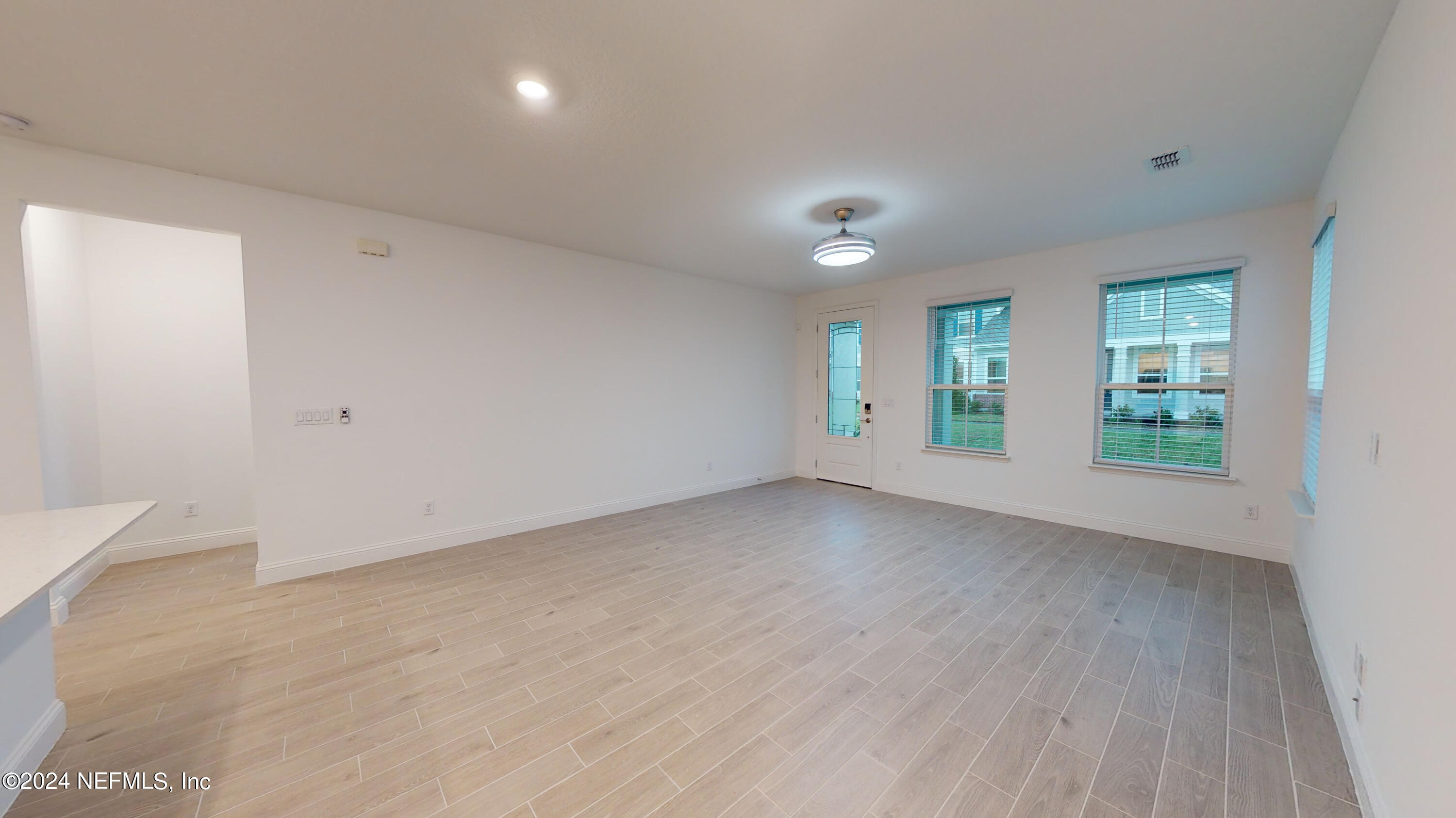 52 Tyson Ct Street St. Augustine, FL 32092 - Photo 19 of 31 wooden floor in an empty room with a window