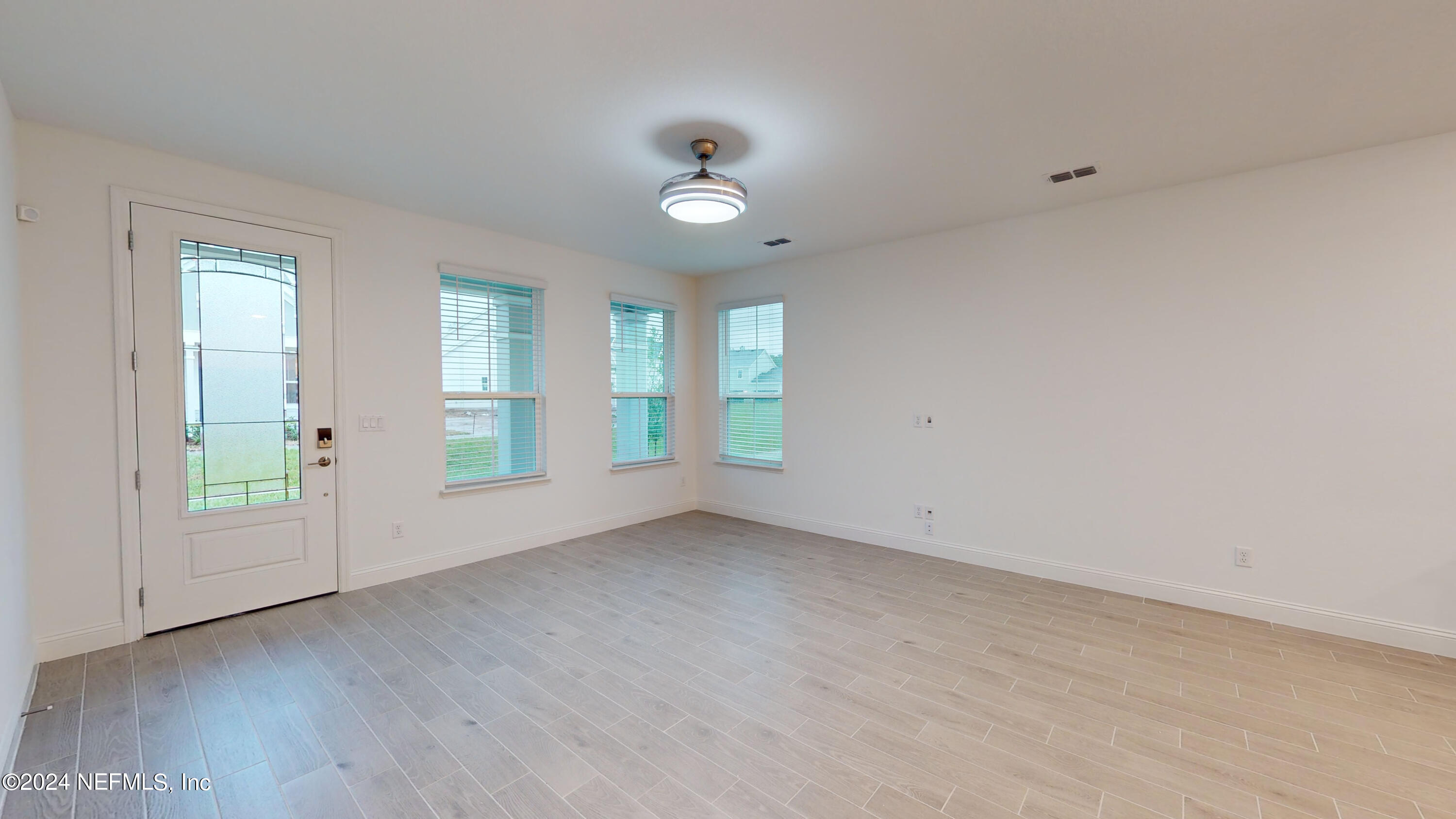 52 Tyson Ct Street St. Augustine, FL 32092 - Photo 6 of 31 wooden floor in an empty room with a window