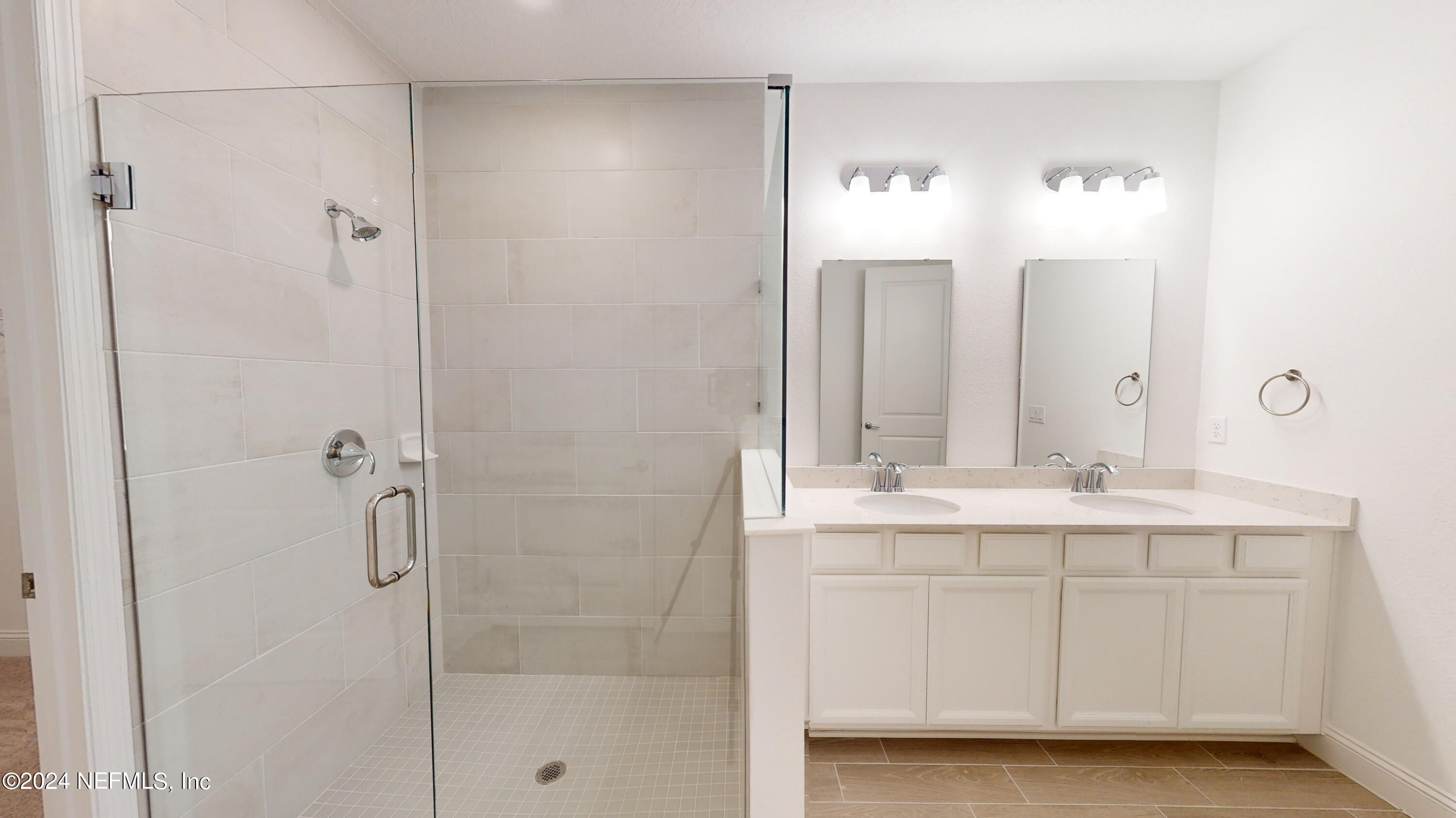 52 Tyson Ct Street St. Augustine, FL 32092 - Photo 9 of 31 a bathroom with a double vanity sink mirror and shower