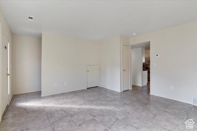947 Canyon Road South, Unit 15 Ogden, UT 84404 - Photo 5 of 22 Empty room featuring baseboards and light tile patterned flooring