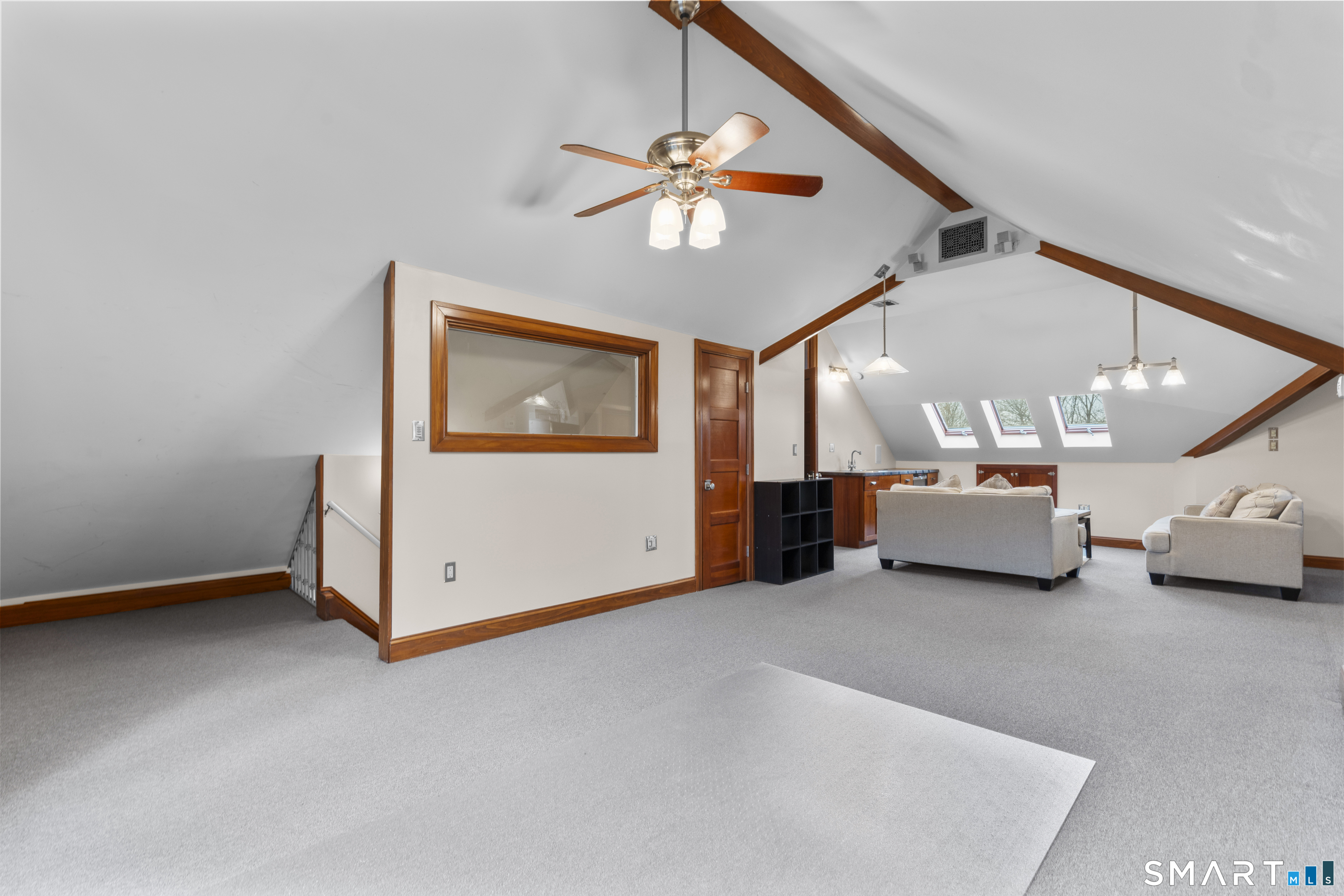 105 Howe Avenue Shelton, CT 06484 - Photo 11 of 38 a view of a livingroom with furniture and a ceiling fan