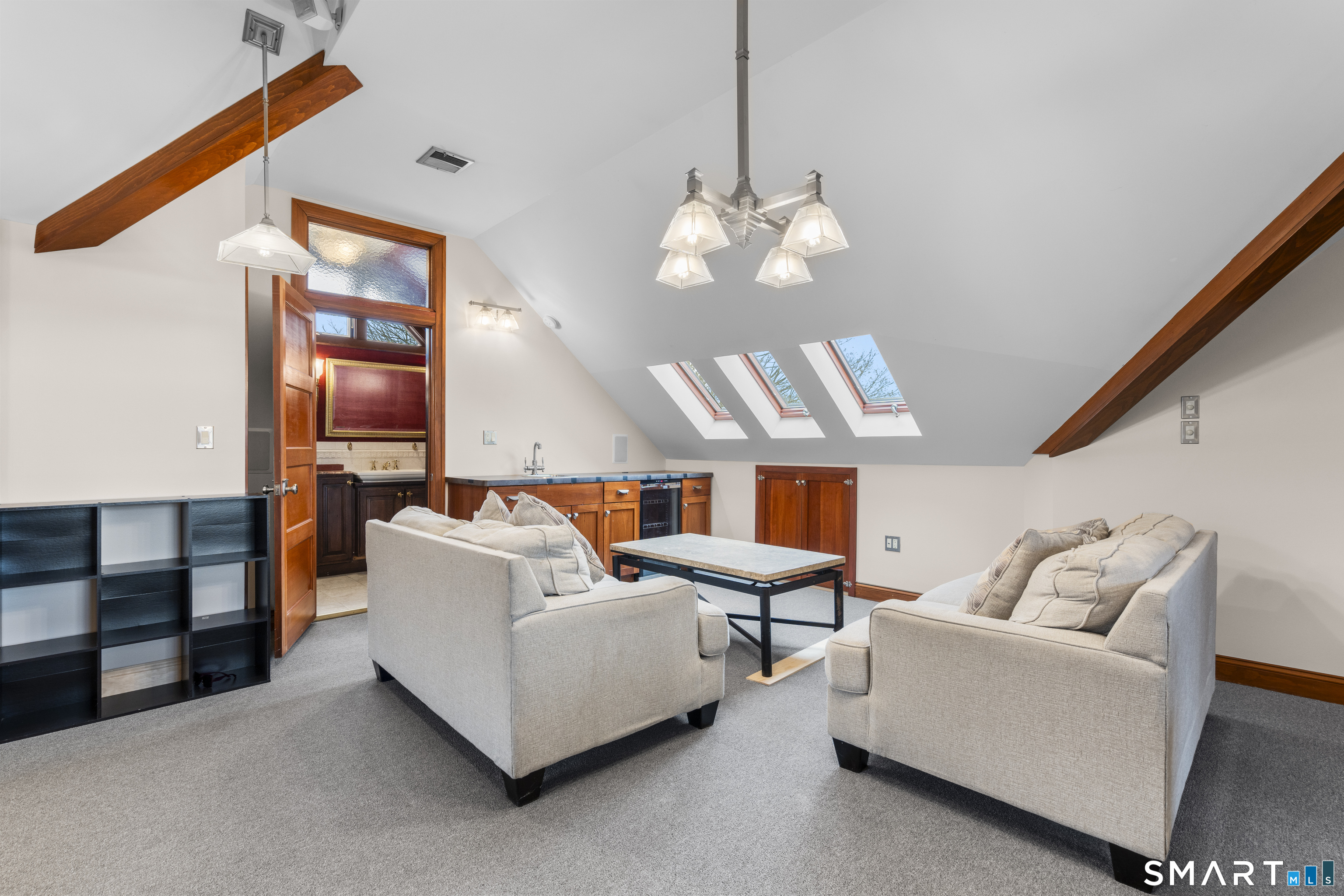 105 Howe Avenue Shelton, CT 06484 - Photo 14 of 38 a living room with furniture chandelier and a flat screen tv