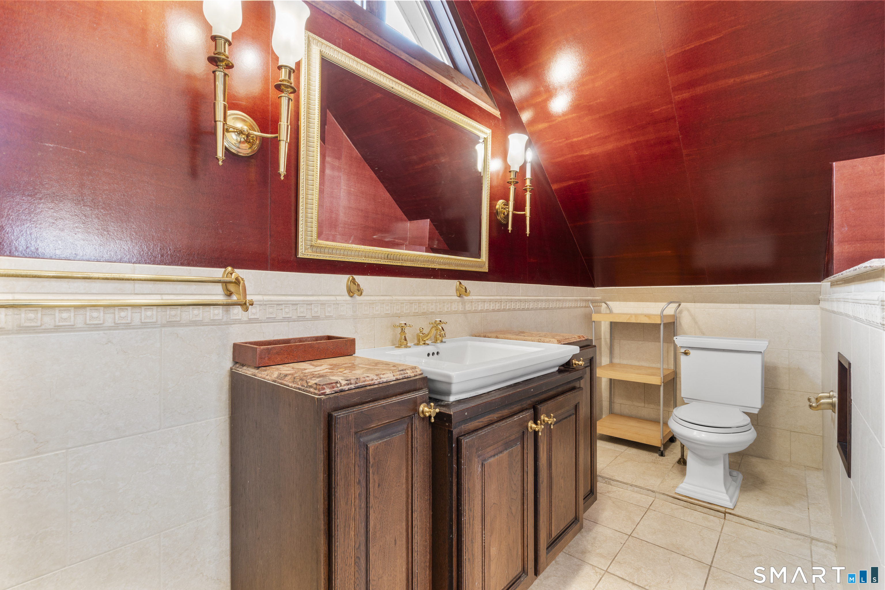 105 Howe Avenue Shelton, CT 06484 - Photo 19 of 38 a bathroom with a granite countertop toilet sink and mirror