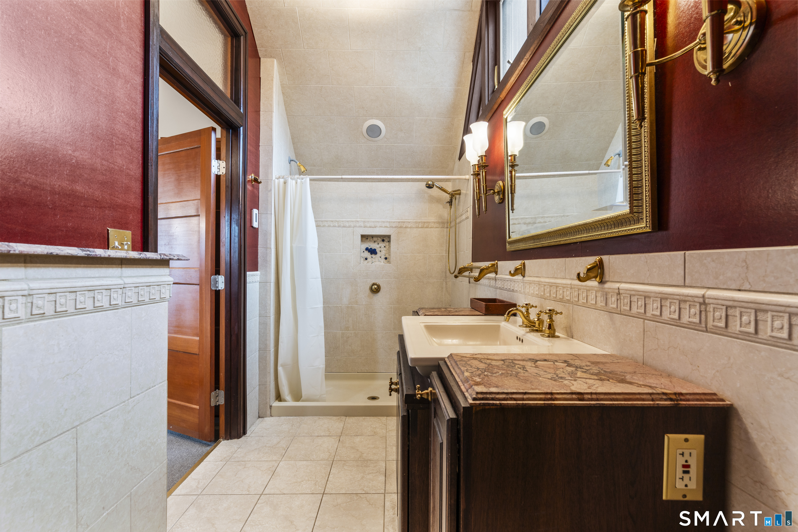 105 Howe Avenue Shelton, CT 06484 - Photo 20 of 38 a bathroom with a sink and a mirror