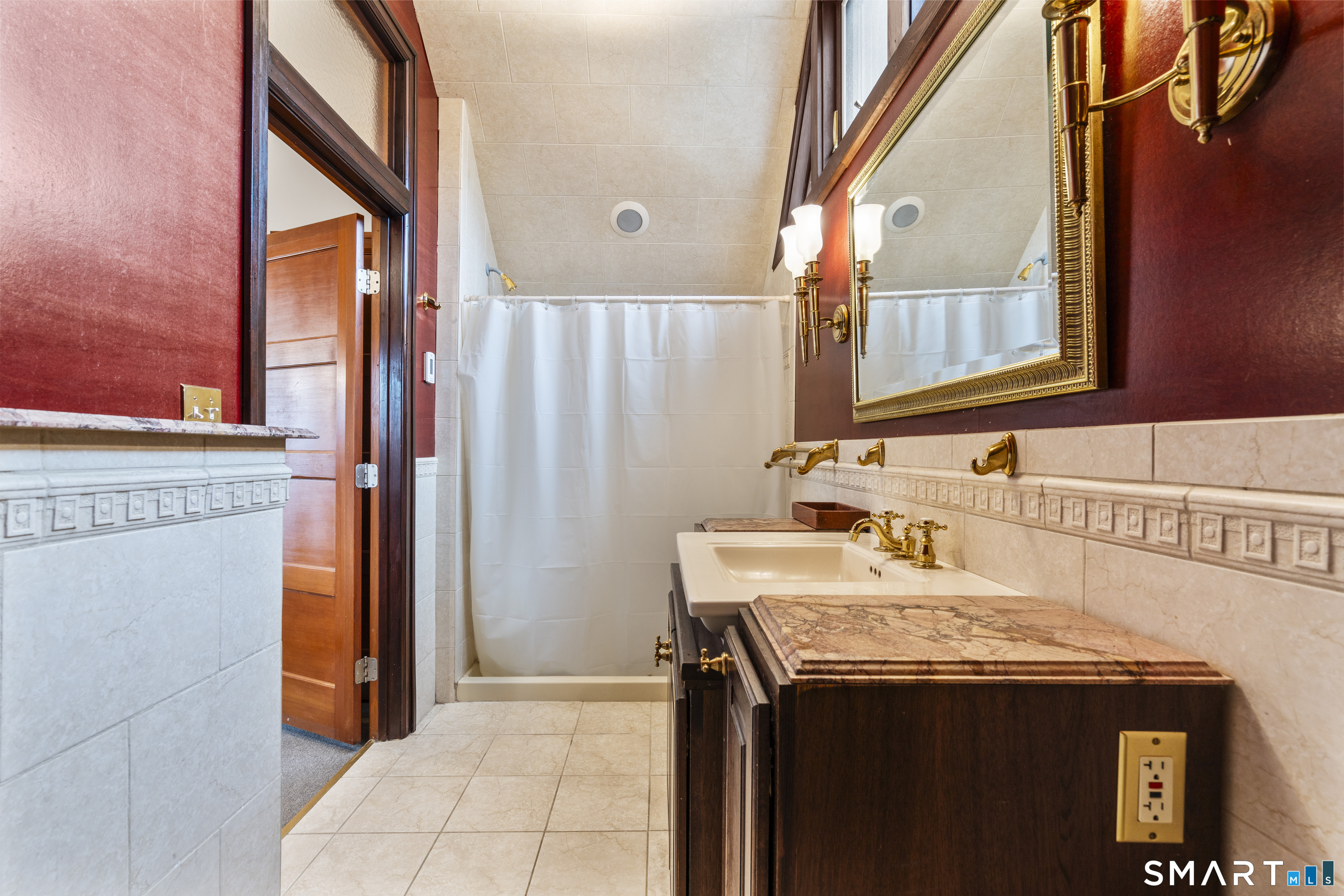 105 Howe Avenue Shelton, CT 06484 - Photo 21 of 38 a bathroom with a sink and a mirror
