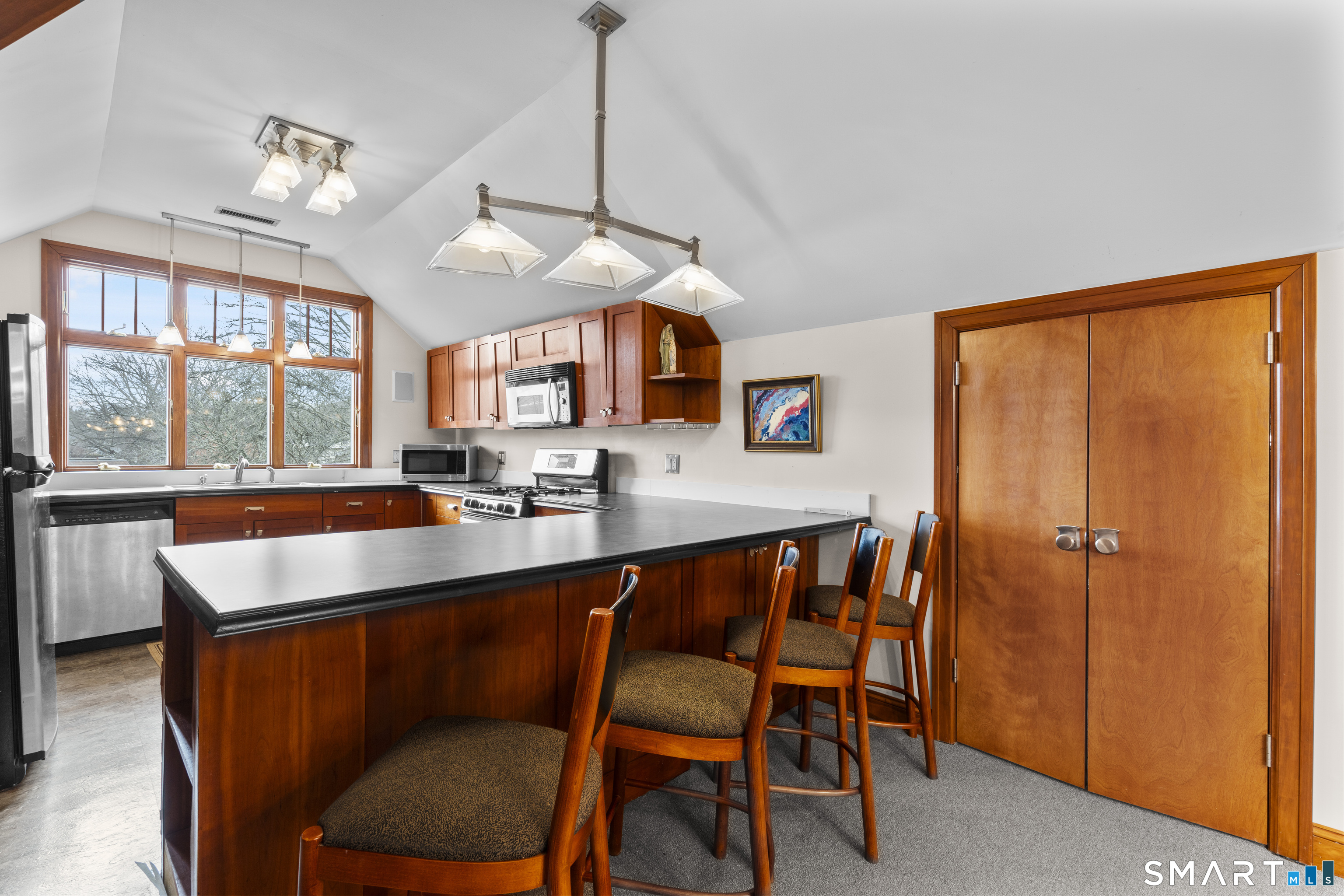 105 Howe Avenue Shelton, CT 06484 - Photo 25 of 38 a view of a dining room with furniture window and wooden floor