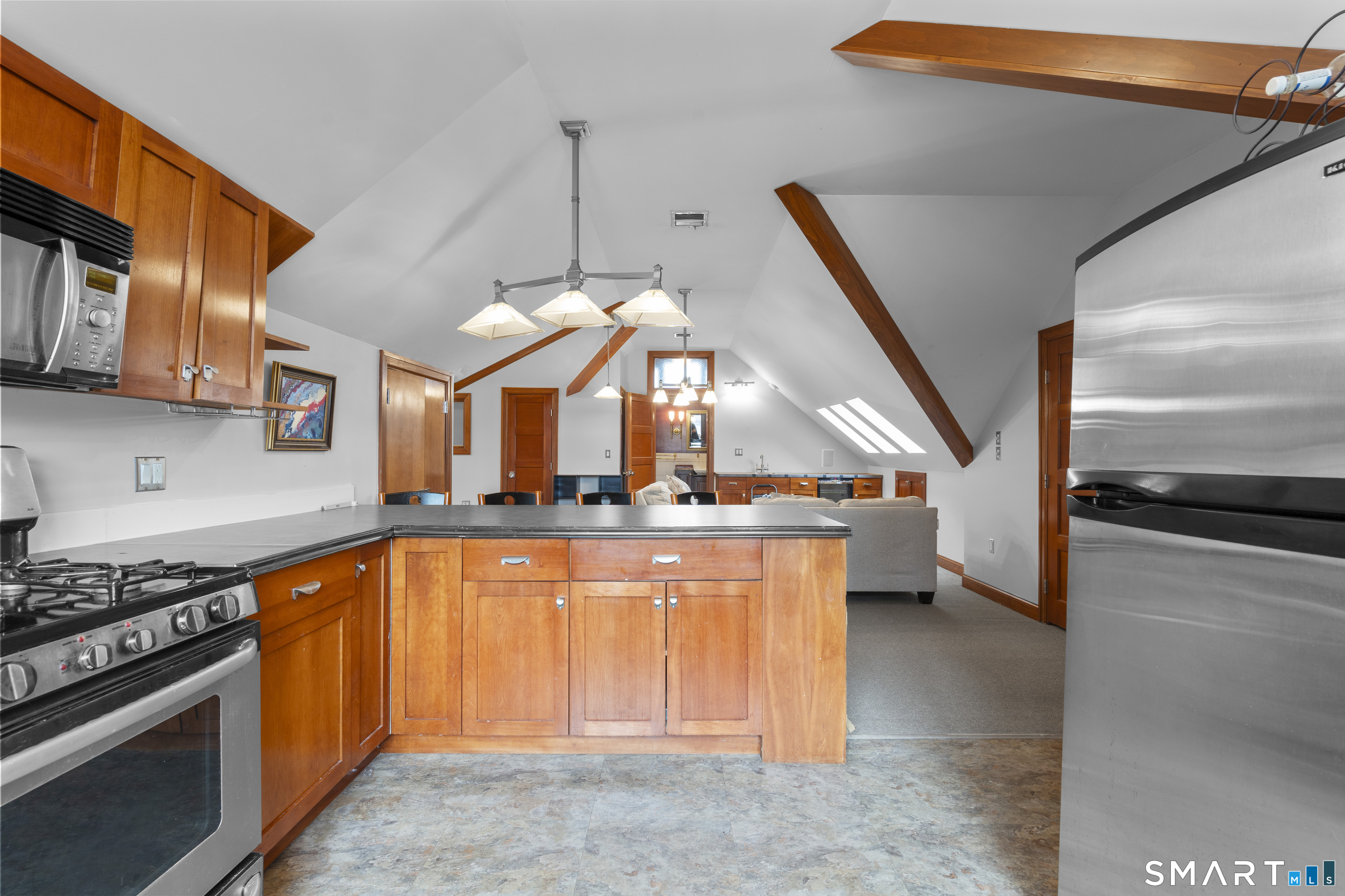 105 Howe Avenue Shelton, CT 06484 - Photo 27 of 38 a kitchen with stainless steel appliances granite countertop a stove a sink and a refrigerator