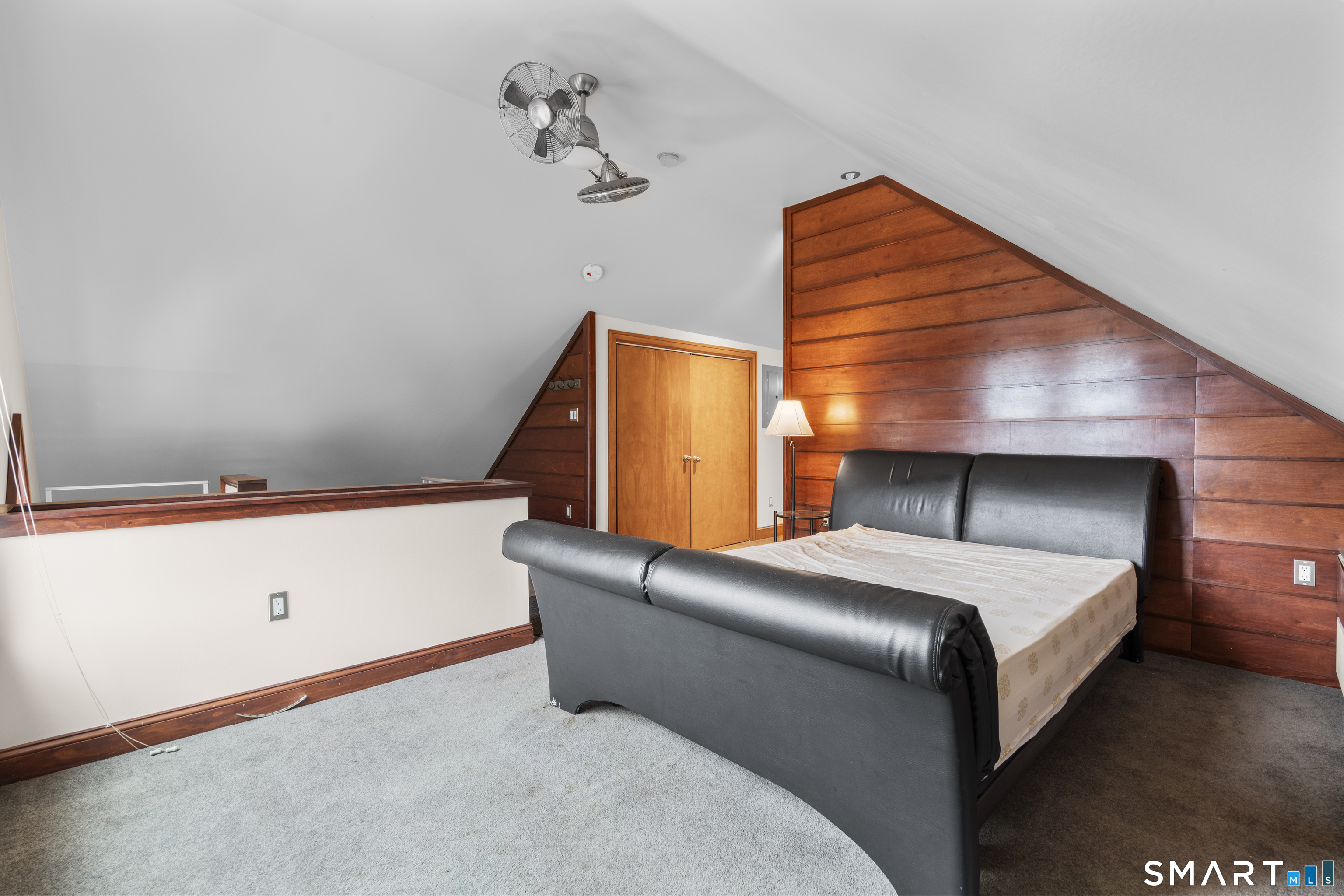 105 Howe Avenue Shelton, CT 06484 - Photo 32 of 38 a bedroom with a bed and lamp