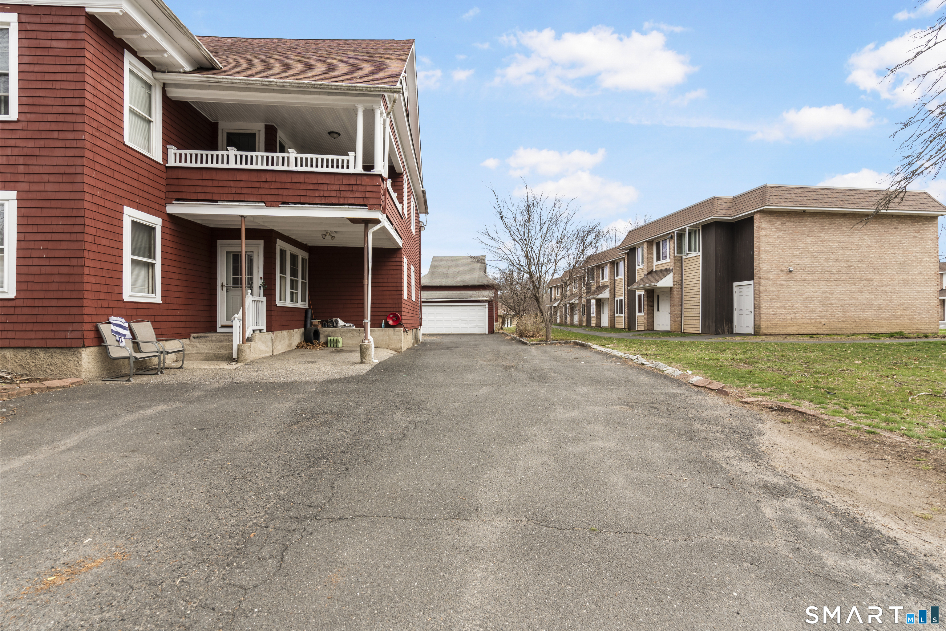 105 Howe Avenue Shelton, CT 06484 - Photo 5 of 38 a view of the house with large windows