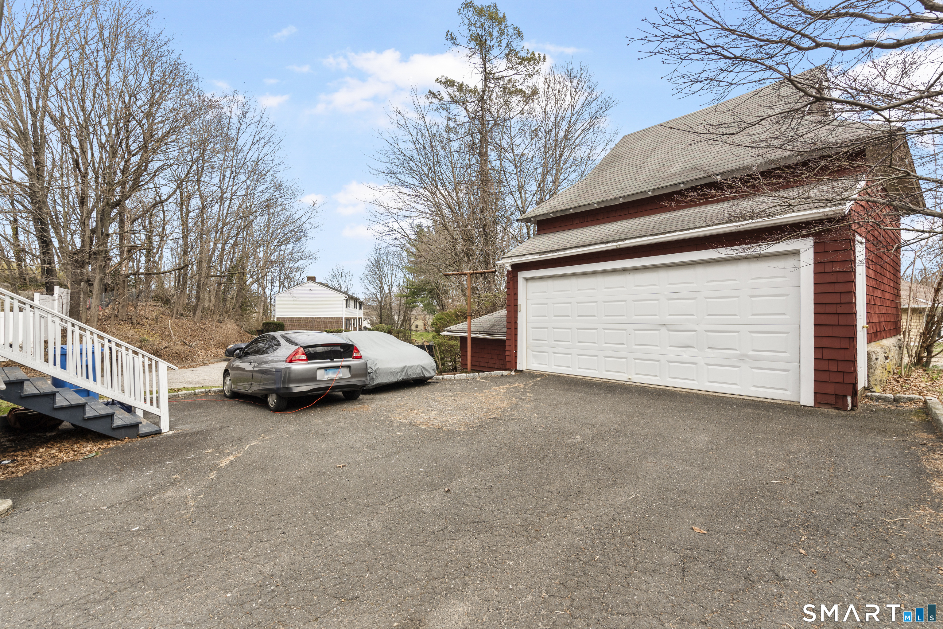 105 Howe Avenue Shelton, CT 06484 - Photo 7 of 38 a view of a car parked in front of a house