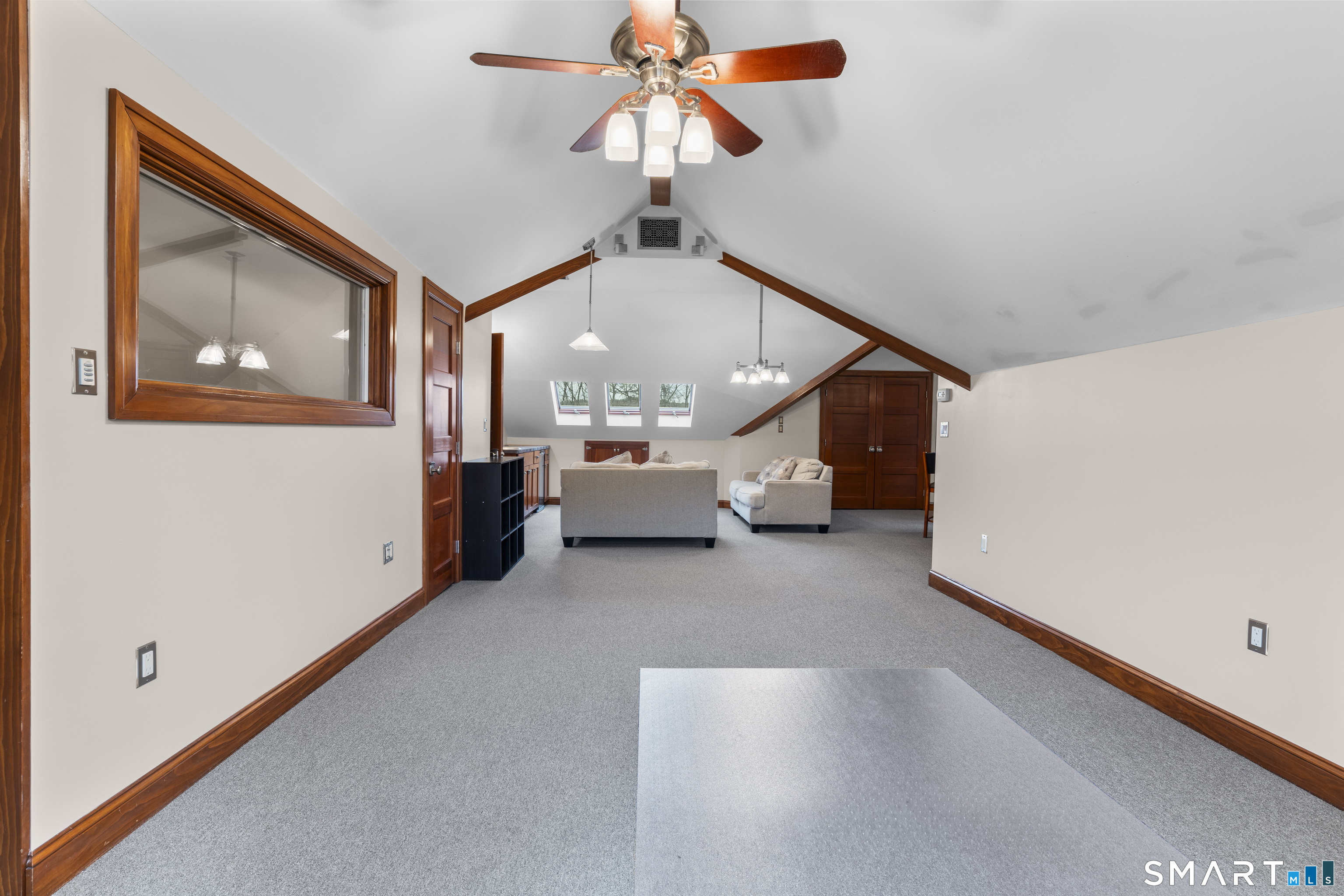 105 Howe Avenue Shelton, CT 06484 - Photo 10 of 38 a living room with furniture and a chandelier