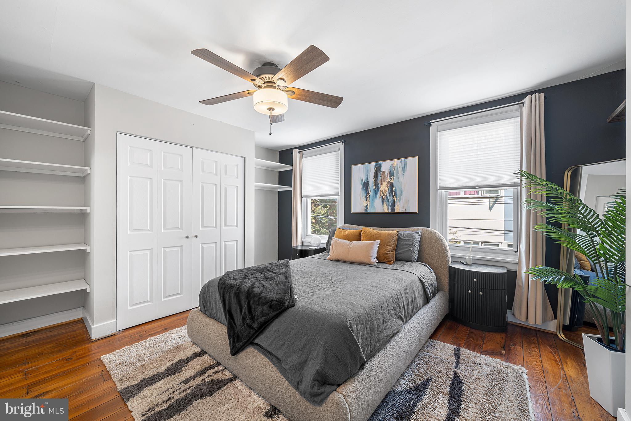 2014 Pemberton Street Philadelphia, PA 19146 - Photo 15 of 24 a bedroom with a bed and a chandelier