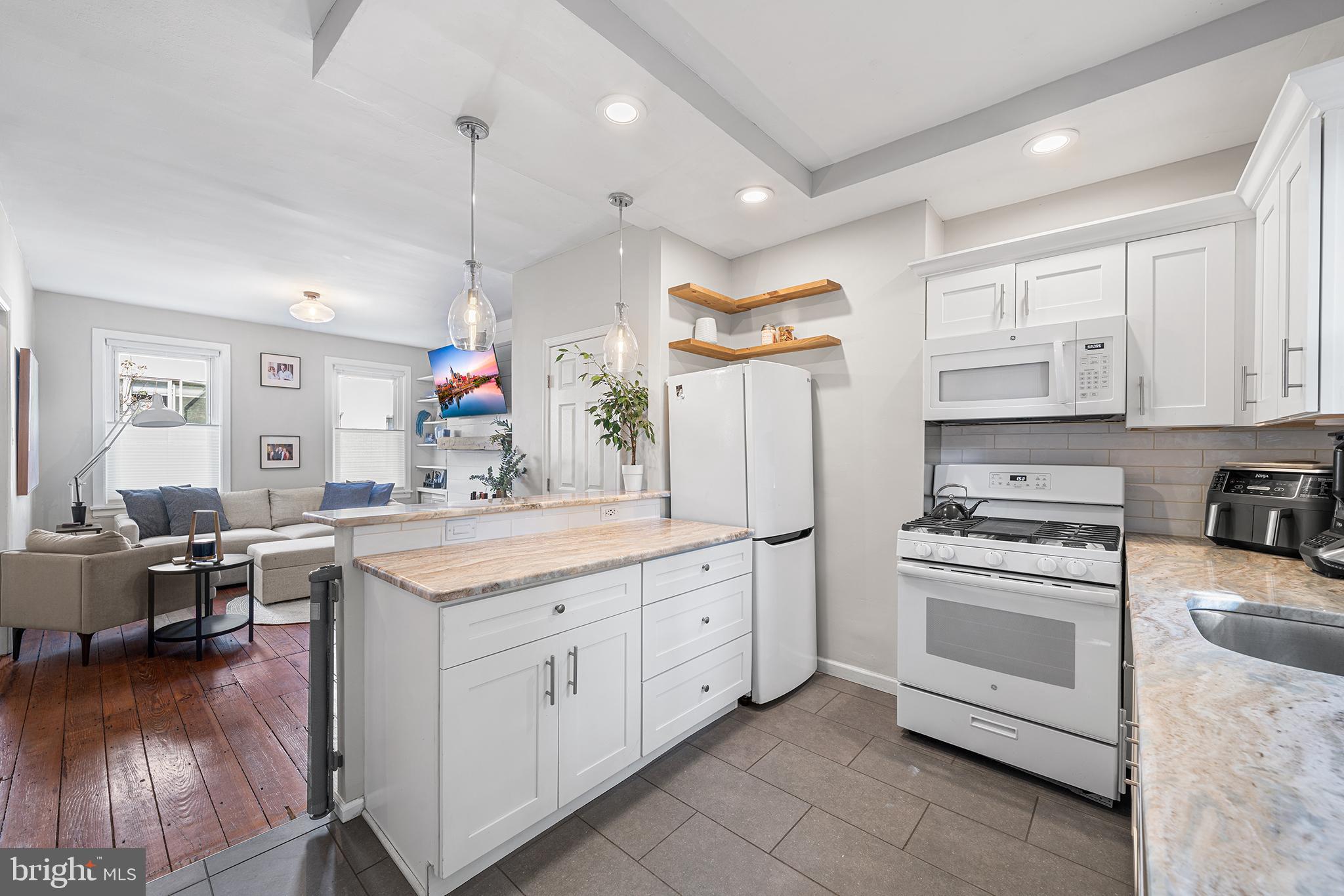 2014 Pemberton Street Philadelphia, PA 19146 - Photo 9 of 24 a kitchen that has a lot of cabinets in it and wooden floors