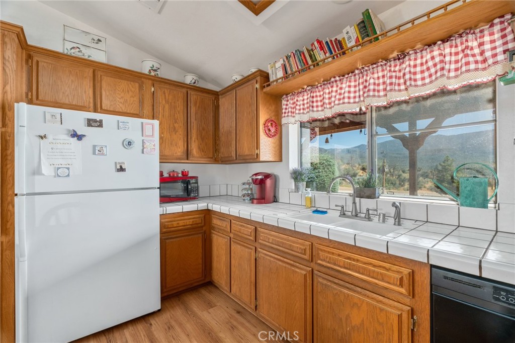 1087 Lockwood Valley Road Maricopa, CA 93252 - Photo 14 of 74 a kitchen with stainless steel appliances a refrigerator and a sink
