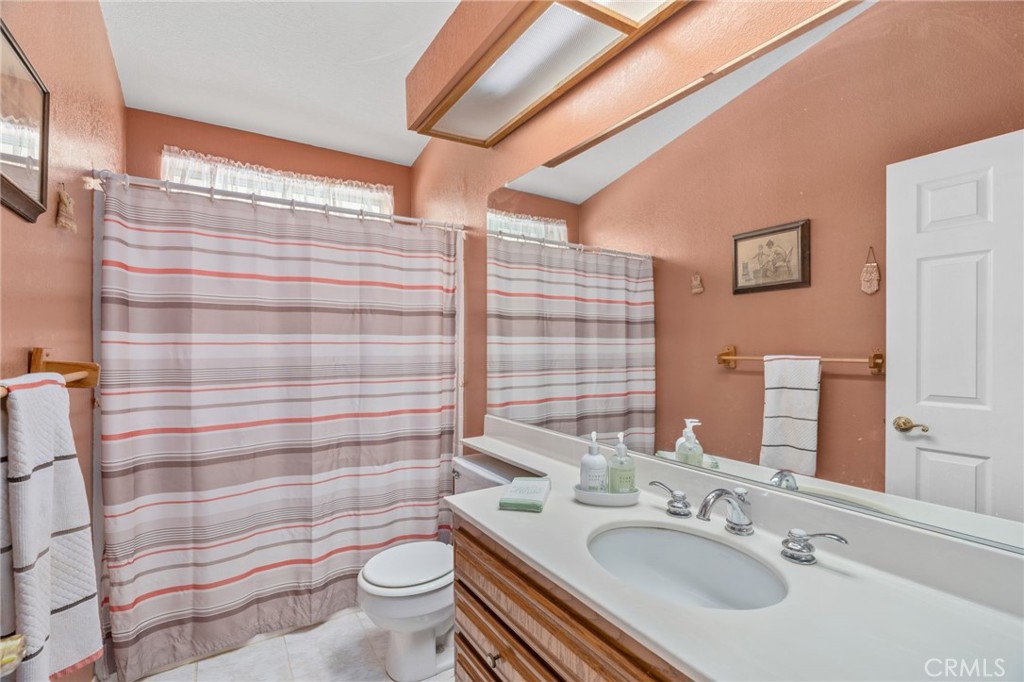 1087 Lockwood Valley Road Maricopa, CA 93252 - Photo 18 of 74 a bathroom with a sink toilet and shower