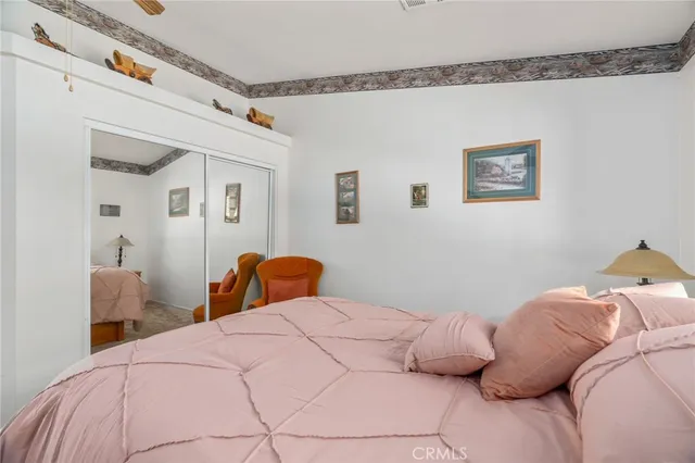 a room with a wooden cabinets and clock on the wall