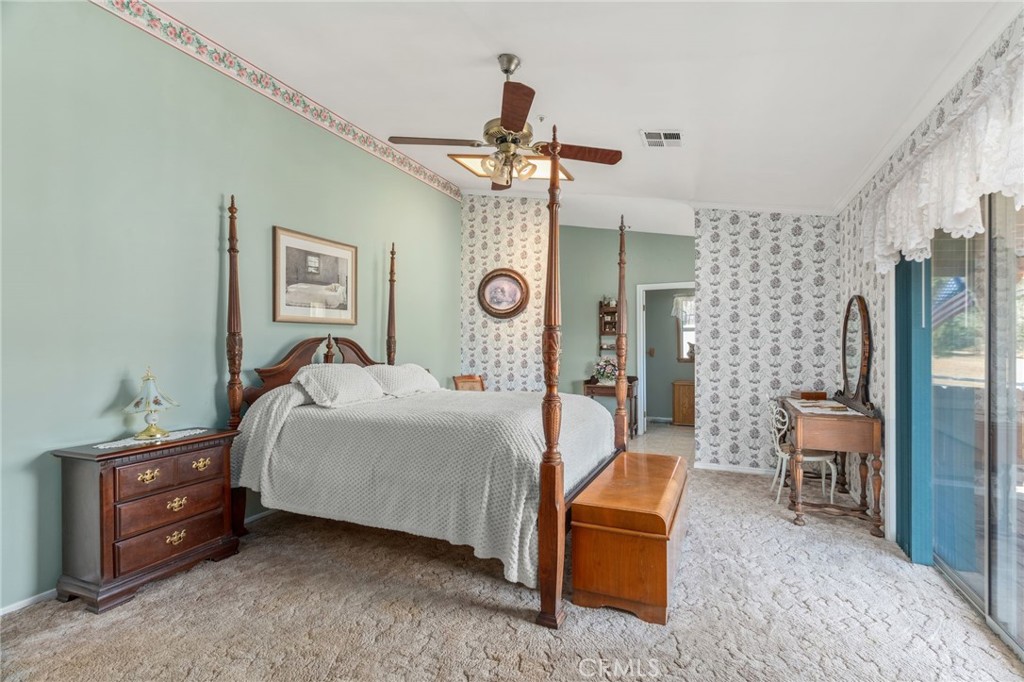 1087 Lockwood Valley Road Maricopa, CA 93252 - Photo 23 of 74 a bedroom with a bed and a chandelier