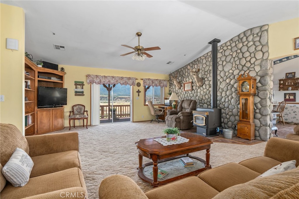 1087 Lockwood Valley Road Maricopa, CA 93252 - Photo 6 of 74 a living room with furniture ceiling fan and a flat screen tv