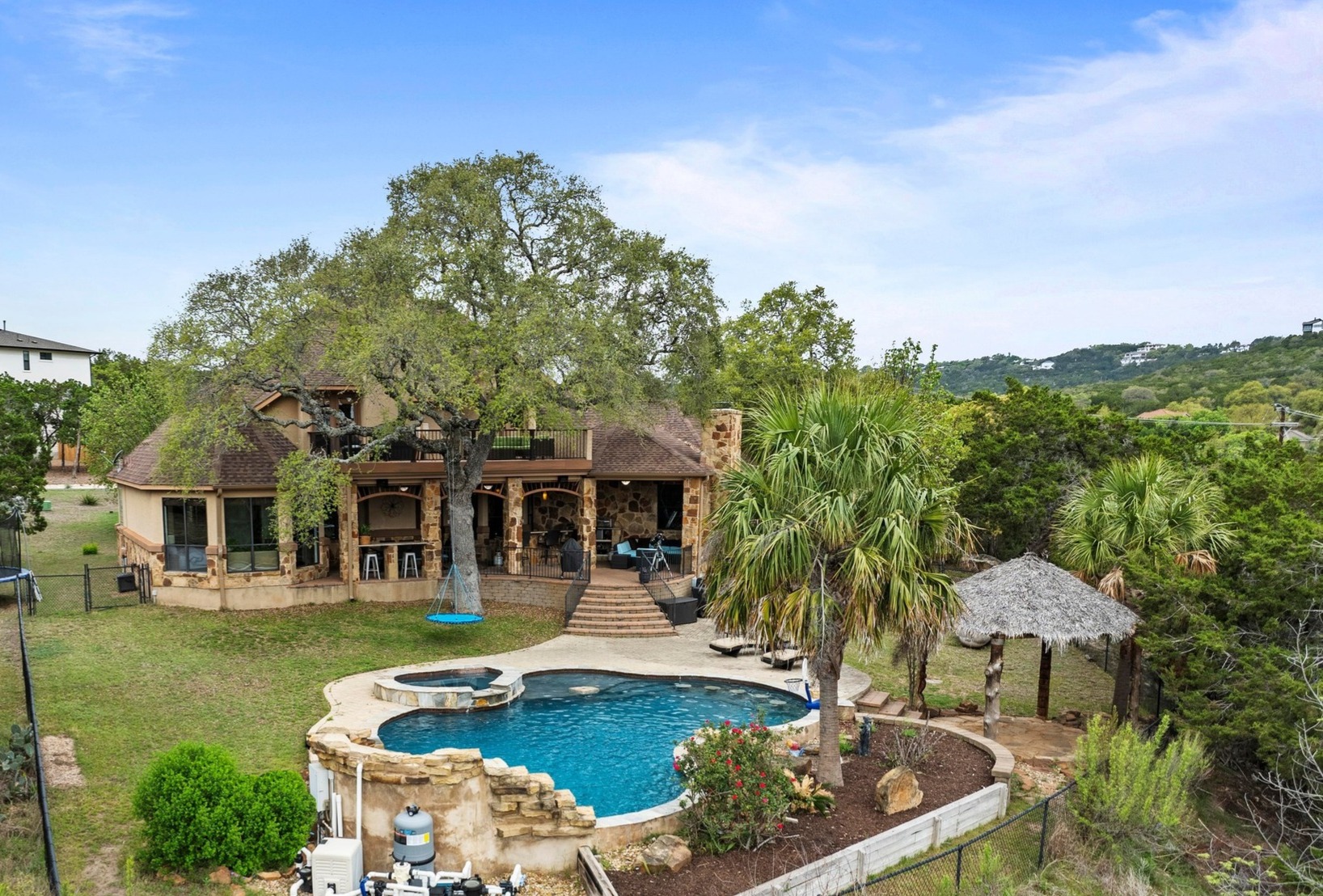 8211 Moon Rise Trail Jonestown, TX 78645 - Photo 6 of 34 This backyard has so much to offer!! Truly an entertainer's dream. The lot also extends beyond the fenced in area to the rear.