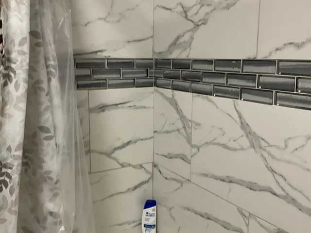 a view of a house with a tree in the yard