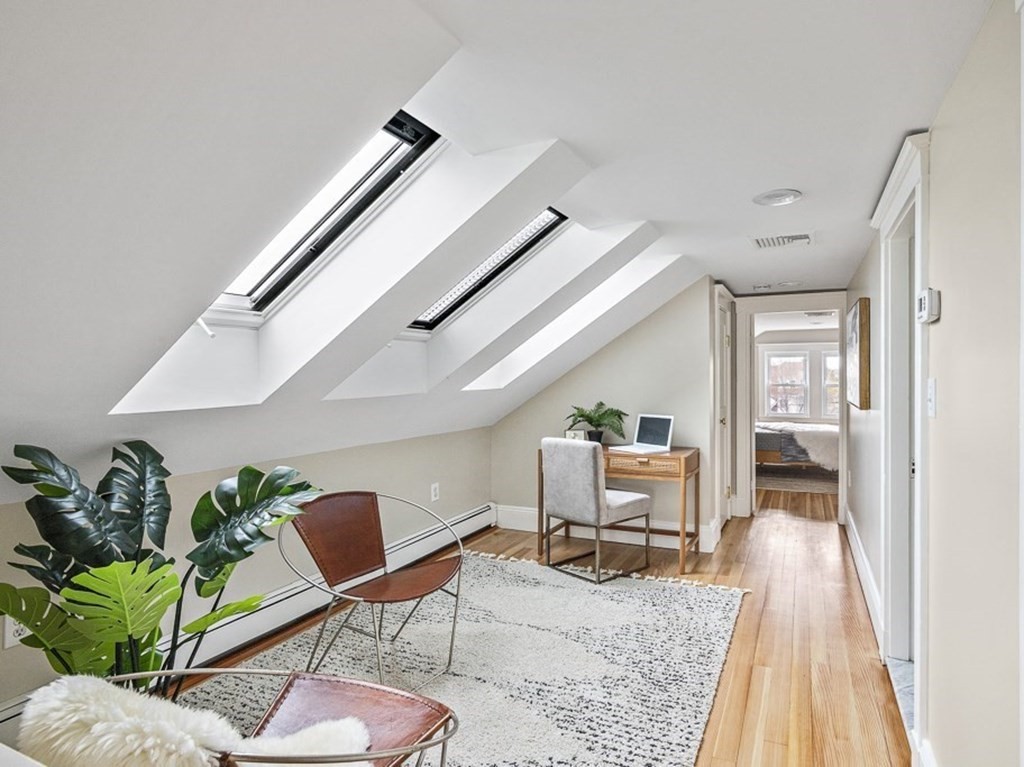 22 Wellington Road Medford, MA 02155 - Photo 11 of 16 a living room with furniture