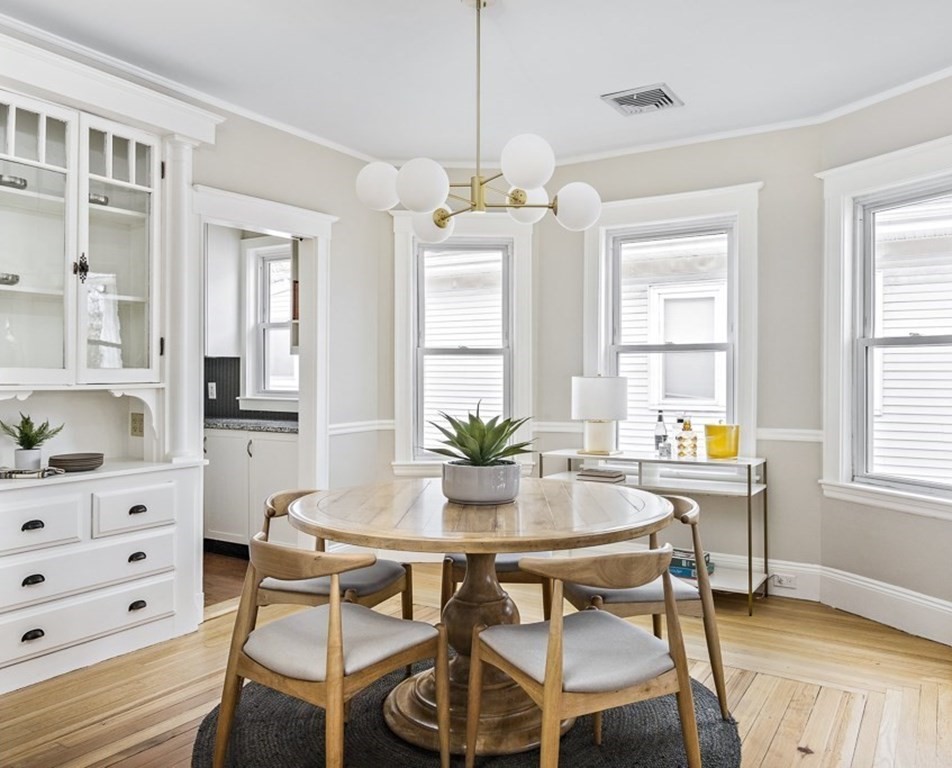 22 Wellington Road Medford, MA 02155 - Photo 4 of 16 a view of a dining room with furniture and window