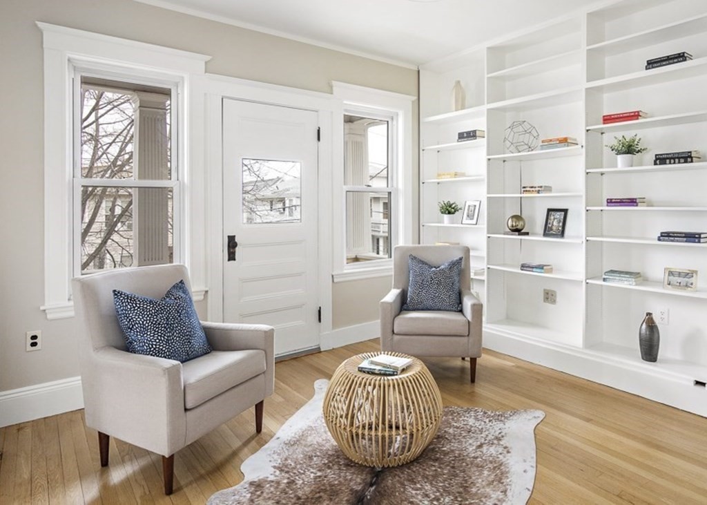 22 Wellington Road Medford, MA 02155 - Photo 6 of 16 a living room with furniture cabinets and a window