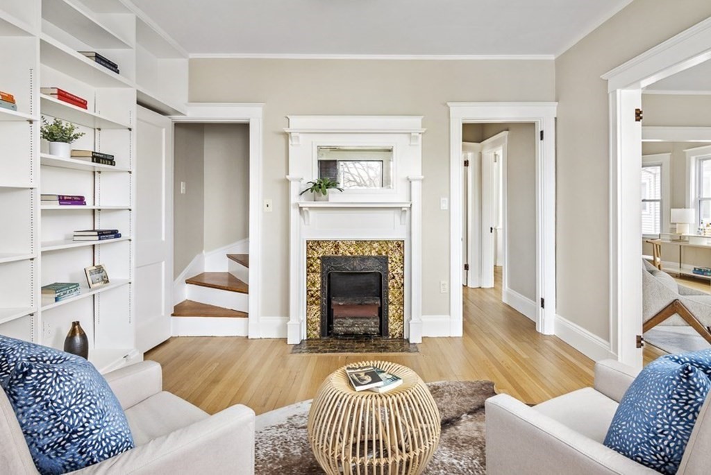 22 Wellington Road Medford, MA 02155 - Photo 7 of 16 a living room with furniture and a fireplace