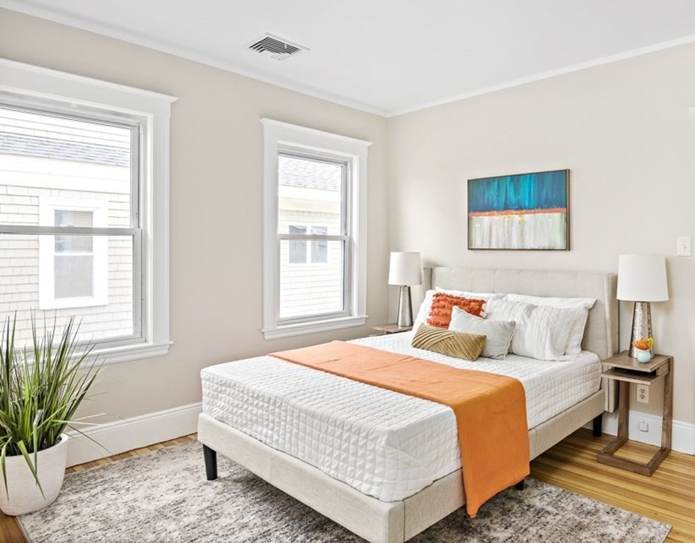 22 Wellington Road Medford, MA 02155 - Photo 8 of 16 a bedroom with bed and a window