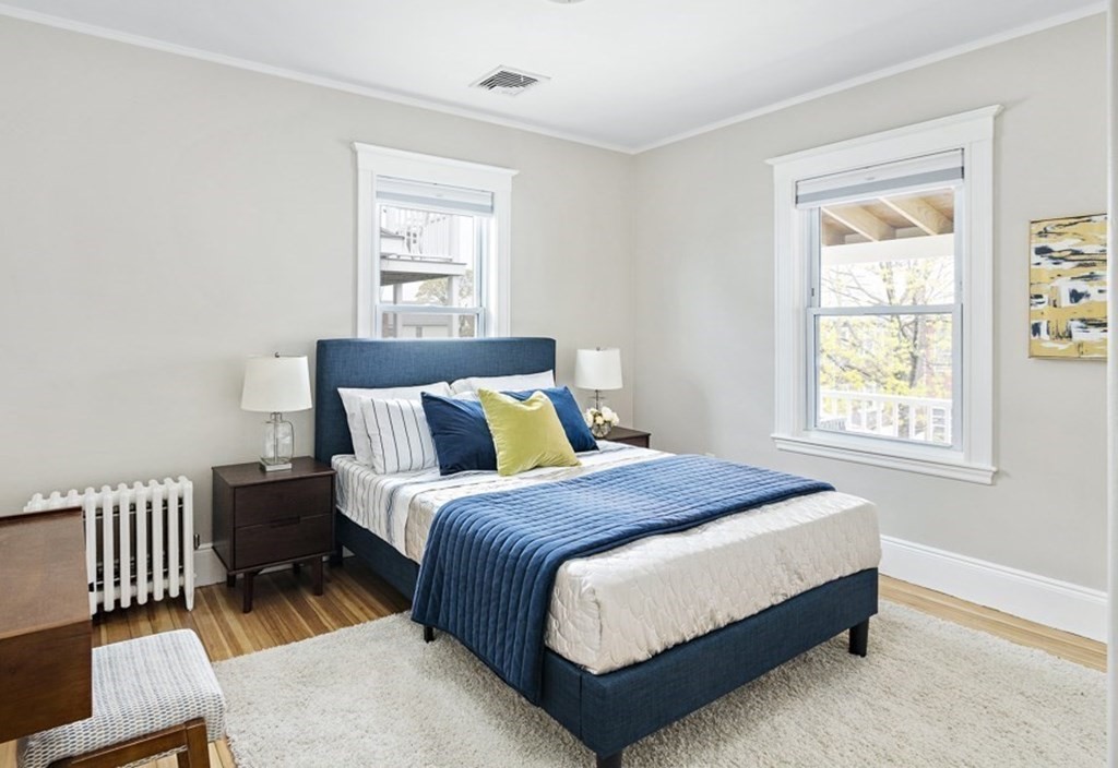 22 Wellington Road Medford, MA 02155 - Photo 9 of 16 a bedroom with a bed and a window