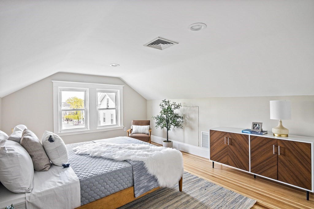22 Wellington Road Medford, MA 02155 - Photo 10 of 16 a bedroom with a bed and window