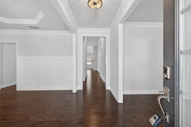 a view of an entryway with wooden floor