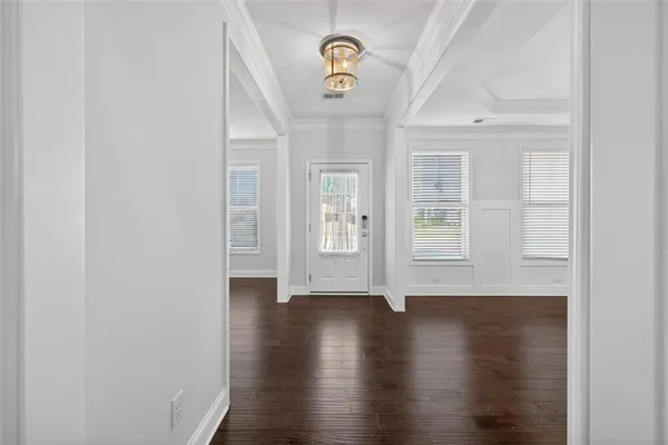 a view of an entryway with wooden floor