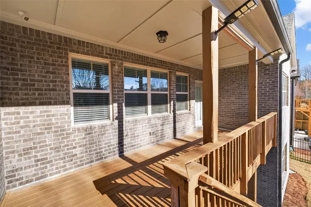 a view of a balcony with wooden floor