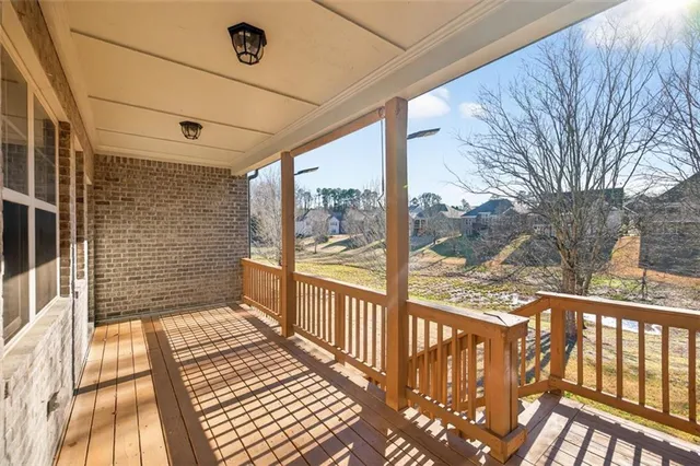 a view of a balcony with wooden floor
