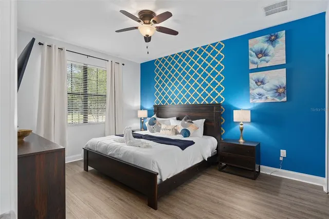 a bedroom with a bed and a window