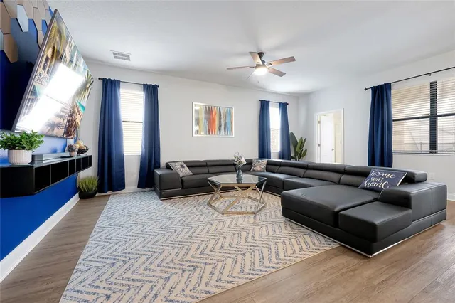 a living room with furniture and a large window