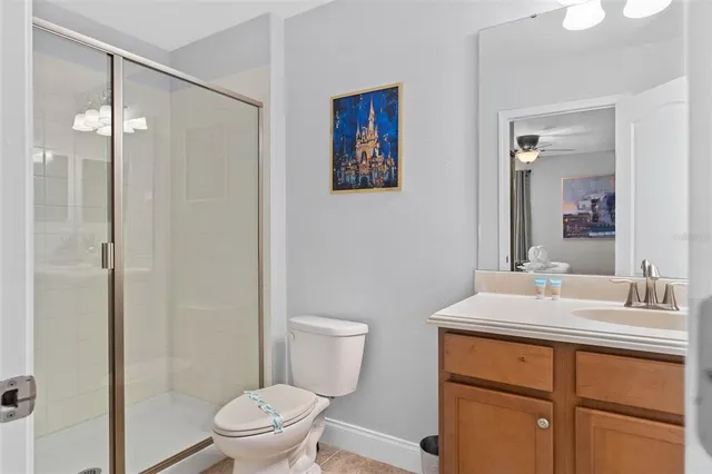 a view of a patio with table and chairs potted plants with floor to ceiling window and potted plants