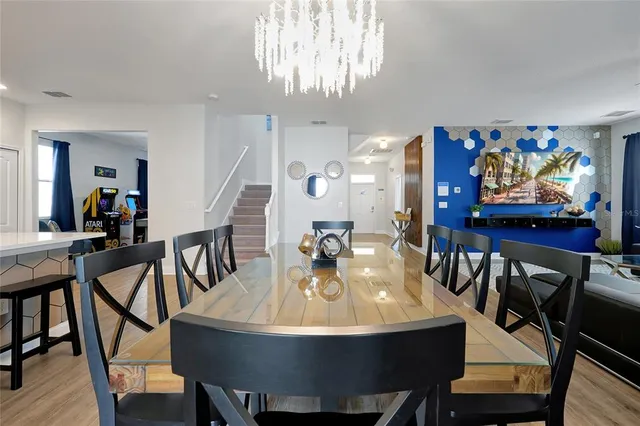 a dining room with furniture and window